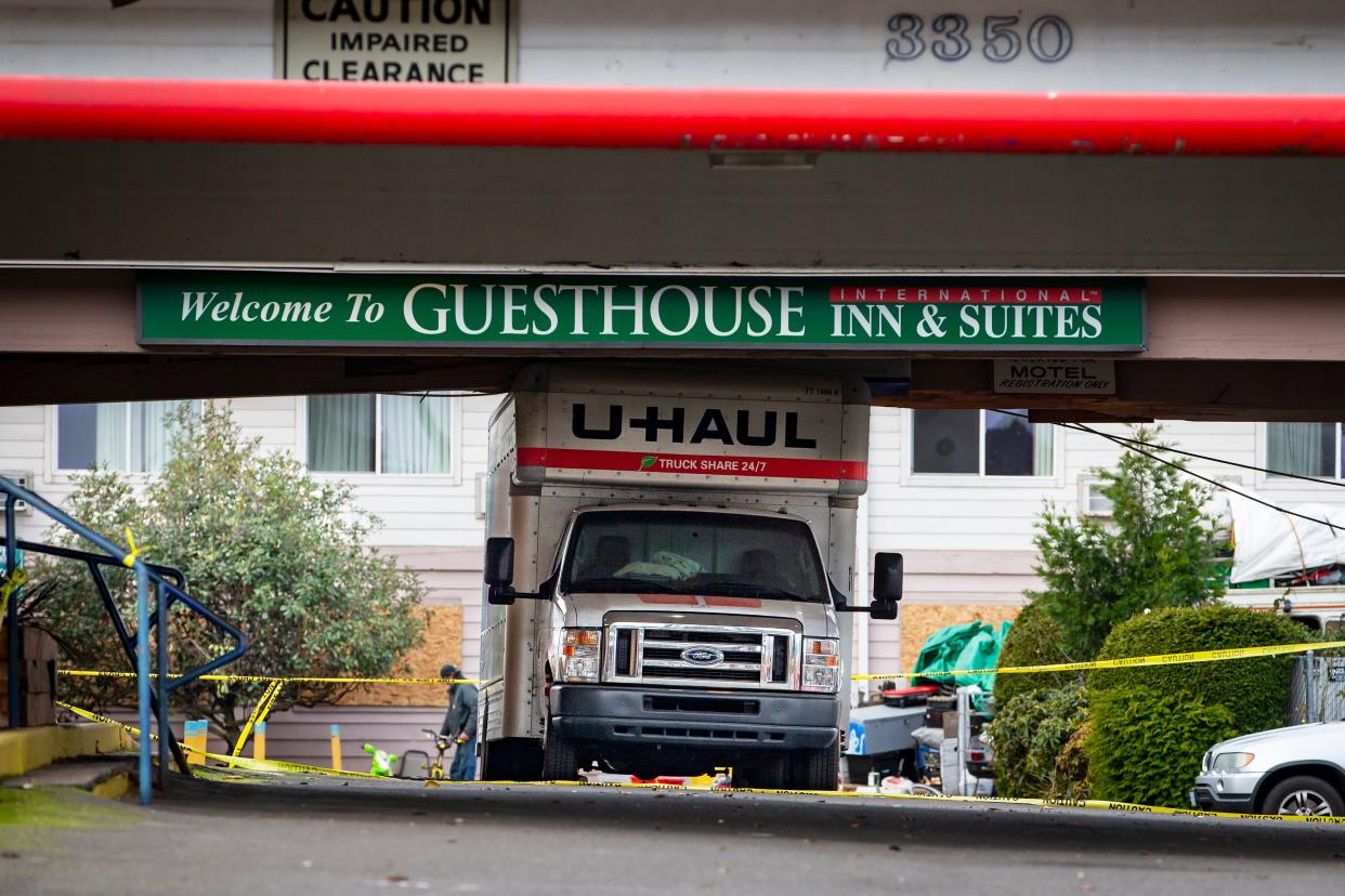 A moving truck sits parked at the GuestHouse Inn and Suites on Gateway Street in Springfield on Thursday.