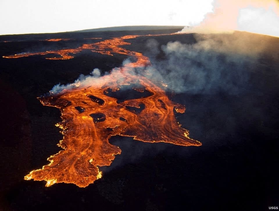 This aerial image released by the US Geological Survey (USGS) on 28 November 2022 courtesy of the National Weather Service, shows the lava in the summit caldera of Mauna Loa (US Geological Survey/AFP via Get)