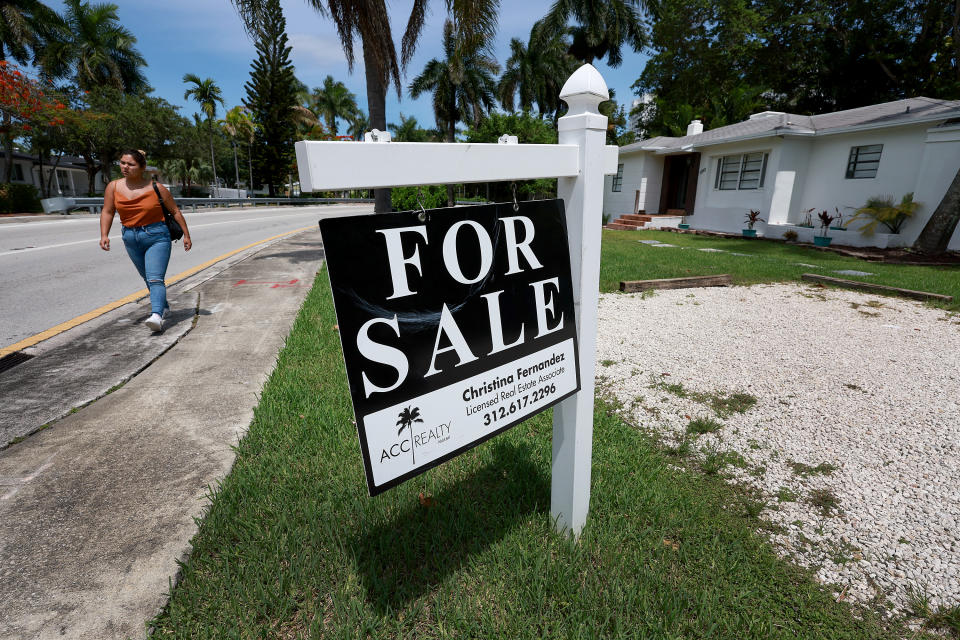 MIAMI, FLORIDA - JUNE 21: A &#39;for sale&#39; sign hangs in front of a home on June 21, 2022 in Miami, Florida. According to the National Association of Realtors, sales of existing homes dropped 3.4% to a seasonally adjusted annualized rate of 5.41 million units. Sales were 8.6% lower than in May 2021. As existing-home sales declined, the median price of a house sold in May was $407,600, an increase of 14.8% from May 2021. (Photo by Joe Raedle/Getty Images)