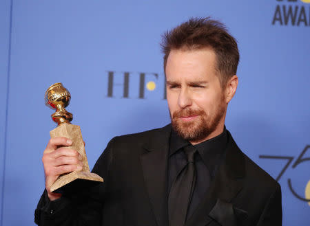 75th Golden Globe Awards – Photo Room – Beverly Hills, California, U.S., 07/01/2018 – Sam Rockwell holds the award for Best Performance by an Actor in a Supporting Role in a Motion Picture for his role in "Three Billboards Outside Ebbing, Missouri". REUTERS/Lucy Nicholson