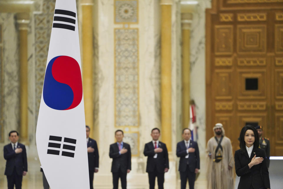 South Korean first lady Kim Keon Hee listens to a military band at Qasar Al Watan in Abu Dhabi, United Arab Emirates, Sunday, Jan. 15, 2023. South Korean President Yoon Suk Yeol received an honor guard welcome Sunday on a trip to the United Arab Emirates, where Seoul hopes to expand its military sales while finishing its construction of the Arabian Peninsula's first nuclear power plant. (AP Photo/Jon Gambrell)