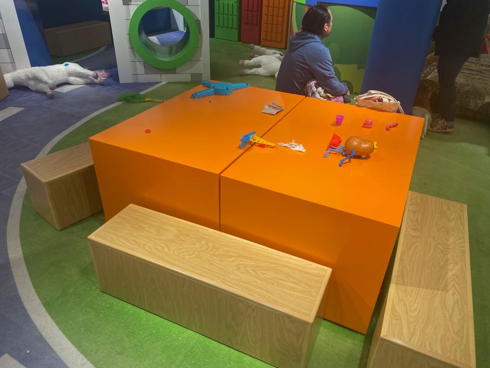 An orange play table.