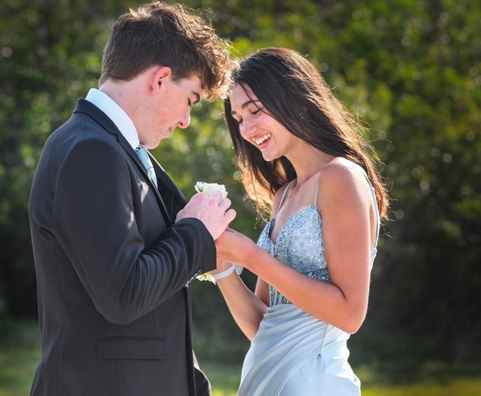 It's prom season in Brevard. Corsages and boutonnieres have been flying off the shelves at local florists and grocery stores. Here, Ella Hovan puts a boutonniere on her date, Ty Pope. They were headed to the Edgewood Jr./Sr. High prom at the Rockledge Country Club.