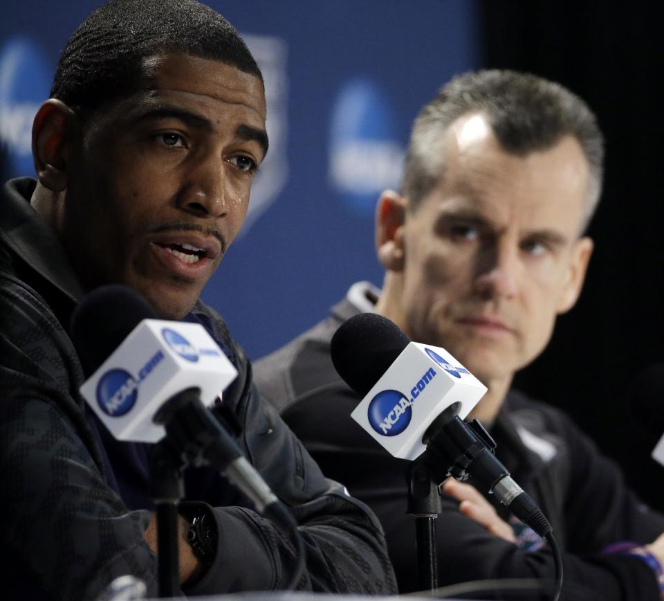 Connecticut head coach Kevin Ollie, left, and Florida head coach Billy Donovan participate in a joint news conference for their NCAA Final Four tournament college basketball semifinal game Thursday, April 3, 2014, in Dallas. Connecticut plays Florida on Saturday, April 5, 2014. (AP Photo/David J. Phillip)