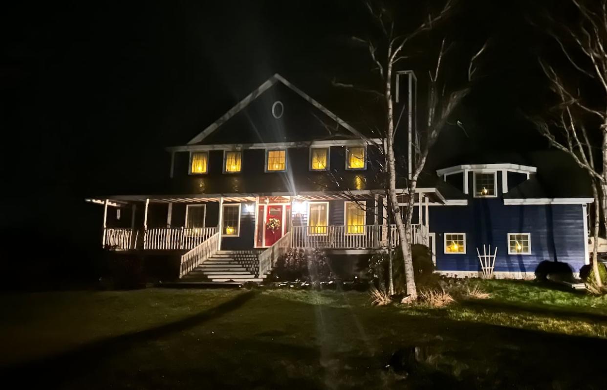 A home in Cape Breton is shown with the candle decorations on full display.  (Kathleen McKenna/CBC - image credit)