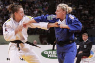 Kayla Harrison of U.S.A, blue jersey, fights with Marhinde Verkerk of Netherlands, during their women's under 78 kg category third place match at the World Judo Championships in Paris Friday, Aug. 26, 2011. Kayla Harrison won bronze. (Photo/Markus Schreiber)