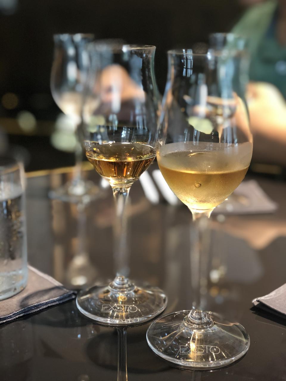 (From left to right) Sampling the Exsto Élixir, which contains 40% alcohol content, on its own and with an ice-cube. Adding ice-cubes will dilute the cognac and reduce the alcohol percentage, which in turn reveals the aromas while making the taste more refreshing. (PHOTO: Sheila Chiang/Yahoo Lifestyle Singapore) 