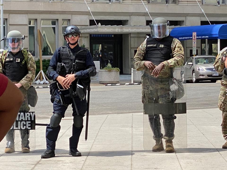 A member of federal law enforcement stands among members of the National Guard on Wednesday. Without nametags or ID on uniforms, especially for officers in riot gear, it could be difficult to identify a particular officer in a misconduct complaint. (Photo: Ryan J. Reilly/HuffPost)