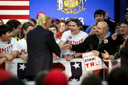 Supporters greet Republican U.S. presidential candidate Donald Trump at a campaign town hall event in Wausau, Wisconsin April 2, 2016. REUTERS/Ben Brewer