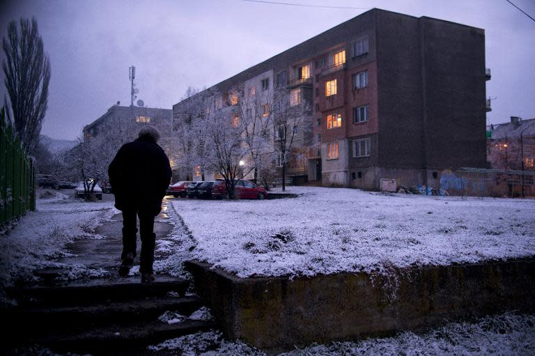 Mircho Koleshev, 60, walks home from a community centre where he works as a night guard in the town of Buhovo, near Sofia, on March 13, 2015