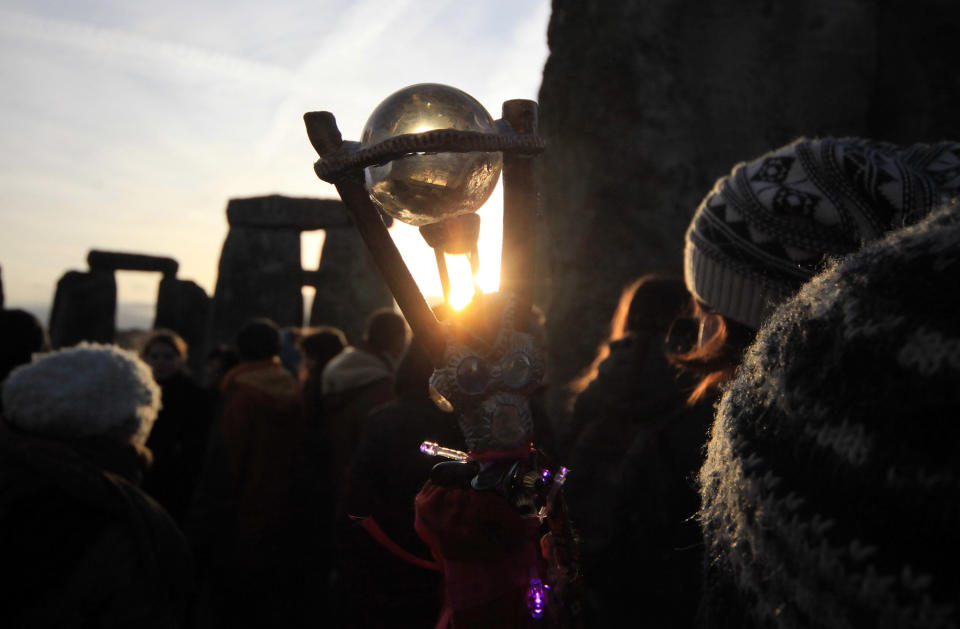 WILTSHIRE, ENGLAND - DECEMBER 22:  Druids, pagans and revelers take part in a winter solstice ceremony at Stonehenge on December 22, 2011 in Wiltshire, England. (Photo by Matt Cardy/Getty Images)