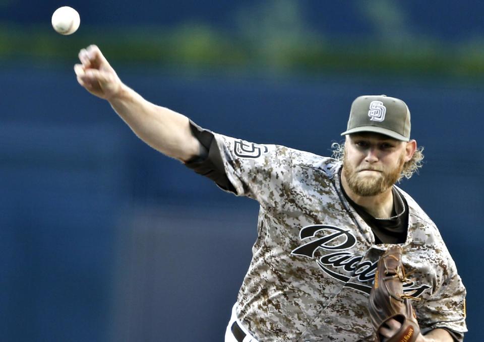 San Diego Padres starting pitcher Andrew Cashner throws against the Los Angeles Dodgers in the first inning of a opening season baseball game, Sunday, March 30, 2014, in San Diego. (AP Photo/Lenny Ignelzi)