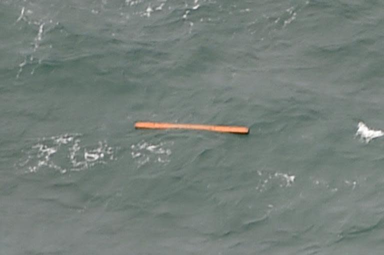 Photo taken from an Indonesian search and rescue aircraft over the Java Sea shows possible plane debris from missing AirAsia flight QZ8501 on December 30, 2014