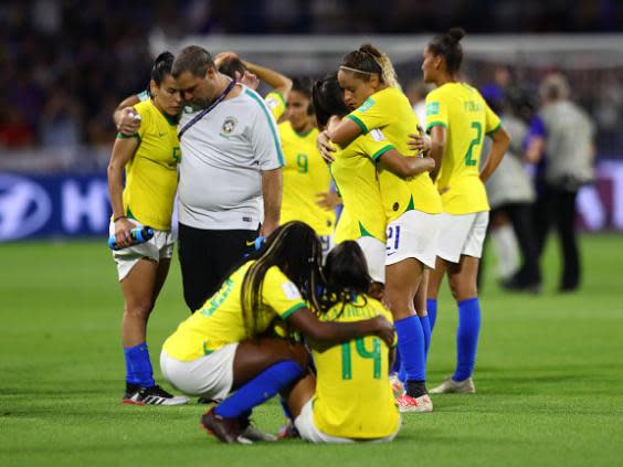 Brazil’s players cut dejected figures after the game (Getty)