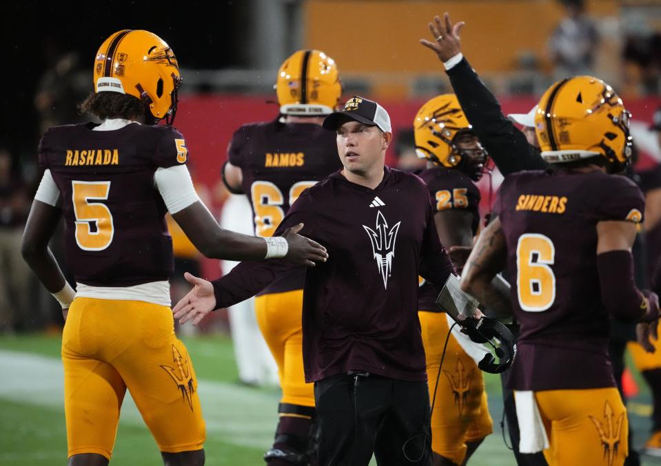 Arizona State head coach Kenny Dillingham greets quarterback Jaden Rashada (5) during action against the Southern Utah Thunderbirds in the second half at Mountain America Stadium in Tempe on Aug. 31, 2023.