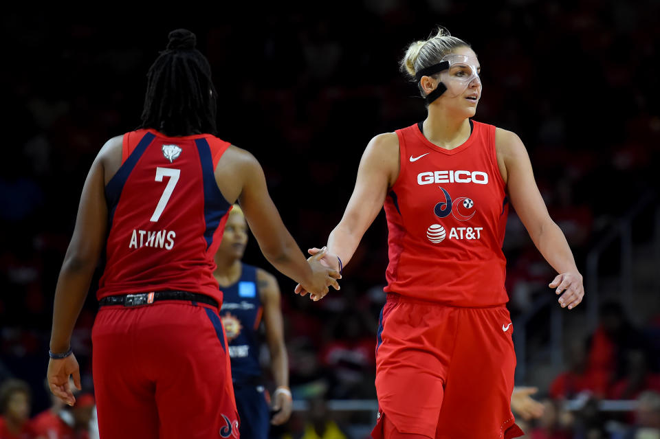 WASHINGTON, DC - SEPTEMBER 29: Elena Delle Donne #11 of the Washington Mystics celebrates with Ariel Atkins #7 after a play against the Connecticut Sun during the first half of WNBA Finals Game One at St Elizabeths East Entertainment & Sports Arena on September 29, 2019 in Washington, DC. NOTE TO USER: User expressly acknowledges and agrees that, by downloading and or using this photograph, User is consenting to the terms and conditions of the Getty Images License Agreement. (Photo by Will Newton/Getty Images)