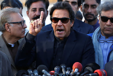 Imran Khan, chairman of the Pakistan Tehreek-e-Insaf (PTI) political party, gestures as he addresses members of the media, after Pakistan's Supreme Court dismissed a petition to disqualify him from parliament for not declaring assets, outside Jinnah International Airport in Karachi, Pakistan December 15, 2017. REUTERS/Akhtar Soomro