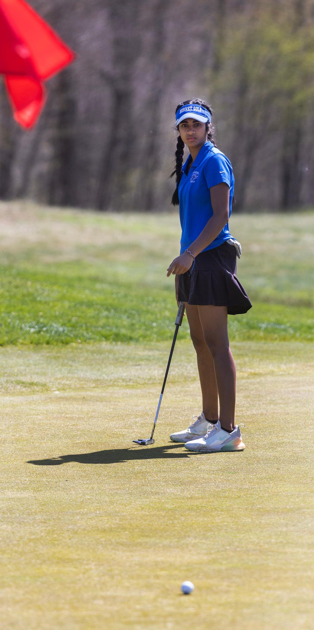 Sirina Gang of Holmdel watches her ball as it rolls toward the 1oth hole. Monmouth County Girls Golf Tournament at Charleston Springs in Millstone, NJ on April 15, 2024.