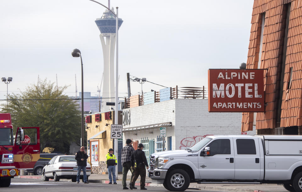 Las Vegas firefighters work the scene of a fire at a three-story apartment complex early Saturday, Dec. 21, 2019 in Las Vegas. The fire was in first-floor unit of the Alpine Motel Apartments and its cause was under investigation, the department said. Authorities say multiple fatalities were reported and several were injured. (Steve Marcus/Las Vegas Sun via AP)