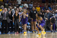 LSU's Alexis Morris (45) celebrates with the bench moments in the closing seconds against Utah in a Sweet 16 college basketball game of the women's NCAA Tournament in Greenville, S.C., Friday, March 24, 2023. (AP Photo/Mic Smith)