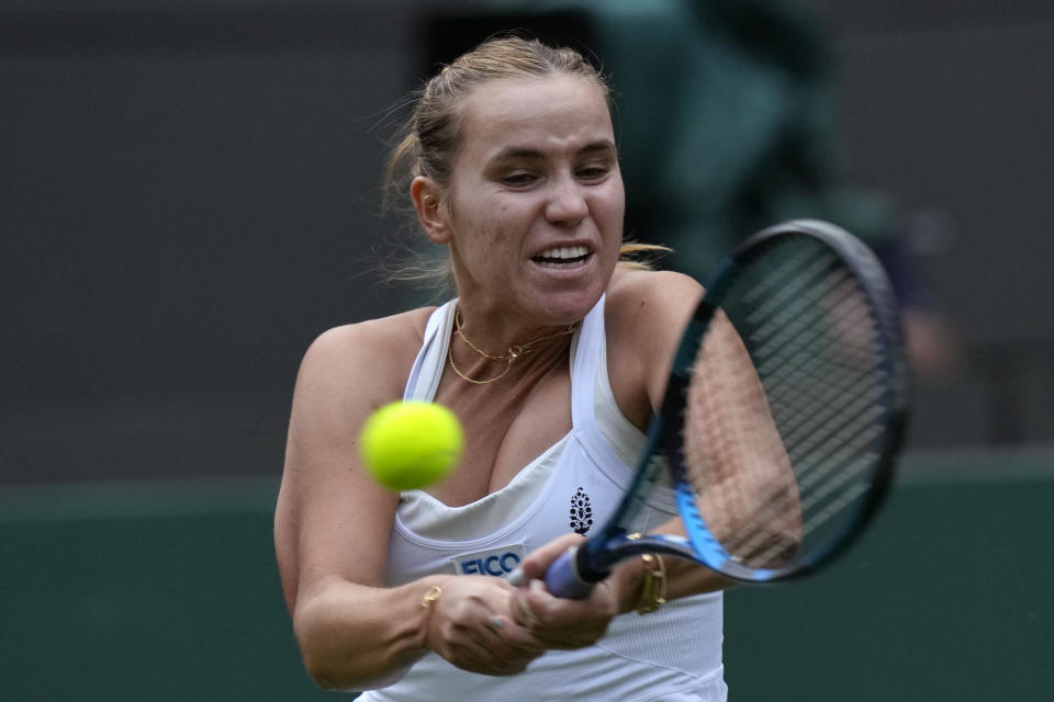 Sofia Kenin of the US plays a return to Coco Gauff of the US during the first round women's singles match on day one of the Wimbledon tennis championships in London, Monday, July 3, 2023. (AP Photo/Alastair Grant)