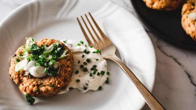 Salmon cake with sour cream and chives