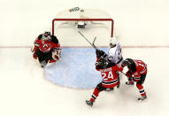 NEWARK, NJ - JUNE 02: Martin Brodeur #30 of the New Jersey Devils makes a save as Bryce Salvador #24 and Peter Harrold #10 of the New Jersey Devils fight for position with Dustin Penner #25 of the Los Angeles Kings during Game Two of the 2012 NHL Stanley Cup Final at the Prudential Center on June 2, 2012 in Newark, New Jersey. (Photo by Jim McIsaac/Getty Images)