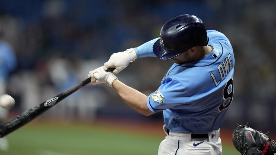Tampa Bay Rays' Brandon Lowe connects for a solo home run off Boston Red Sox relief pitcher Chris Martin during the eighth inning of a baseball game Monday, April 10, 2023, in St. Petersburg, Fla. (AP Photo/Chris O'Meara)