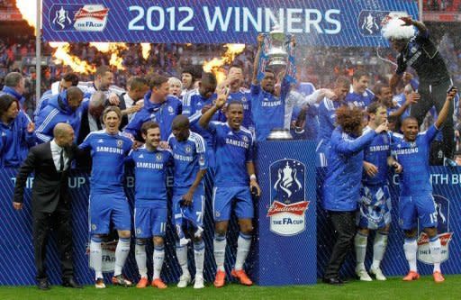 Chelsea's players celebrate on the pitch after Chelsea's 2-1 win in the FA Cup final match against Liverpool at Wembley Stadium in London, on May 5. Roberto di Matteo's side will face Liverpool at Anfield on Tuesday with renewed hope of securing the top four finish that would guarantee their Champions League qualification