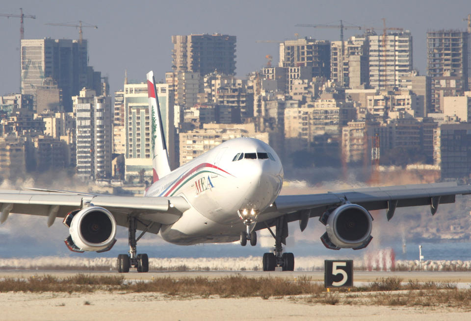 FILE - A Middle East Airlines jet lands at Rafik Hariri International Airport in Beirut, Lebanon, Wednesday Jan. 27, 2010. Stray bullets from gunfire celebrations for the new year hit two parked Middle East Airlines jets at Beirut's airport causing minor damage to the planes without hurting anyone, an airlines official said Sunday, Jan. 1, 2023. (AP Photo/Hussein Malla, File)