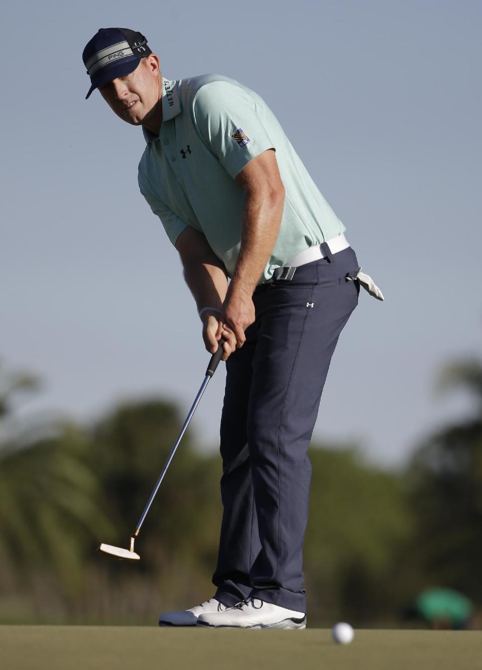 Hunter Mahan hits on the 14th green during the third round of the Cadillac Championship golf tournament Saturday, March 8, 2014, in Doral, Fla. (AP Photo/Lynne Sladky)