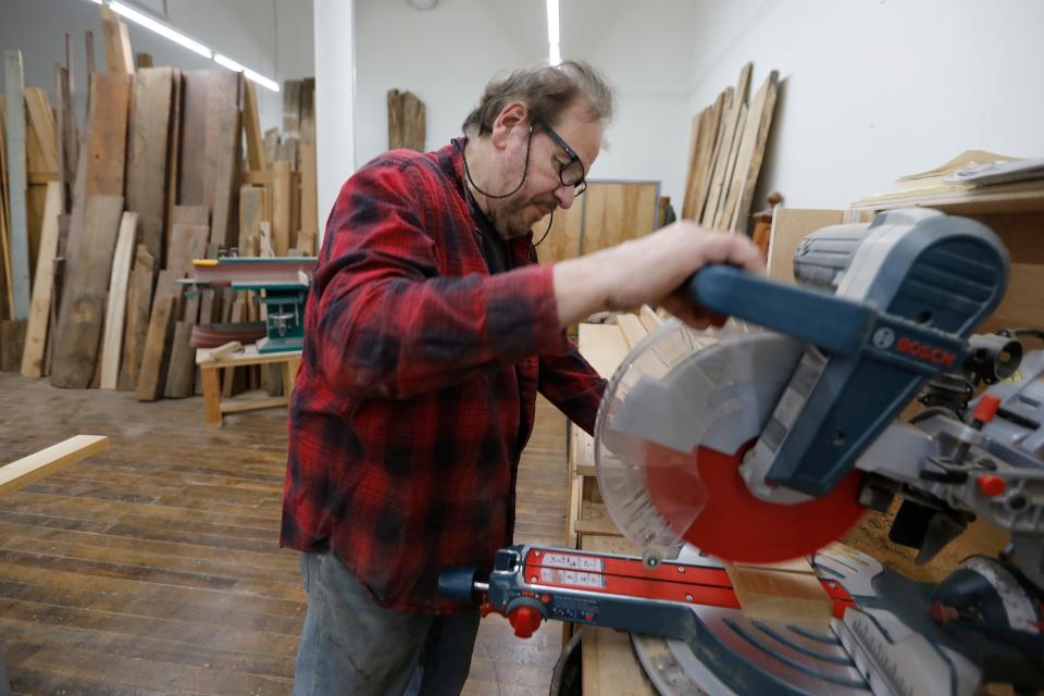 John Giacobbi works on a custom piece in his studio at the Hatch Street Studios in New Bedford.