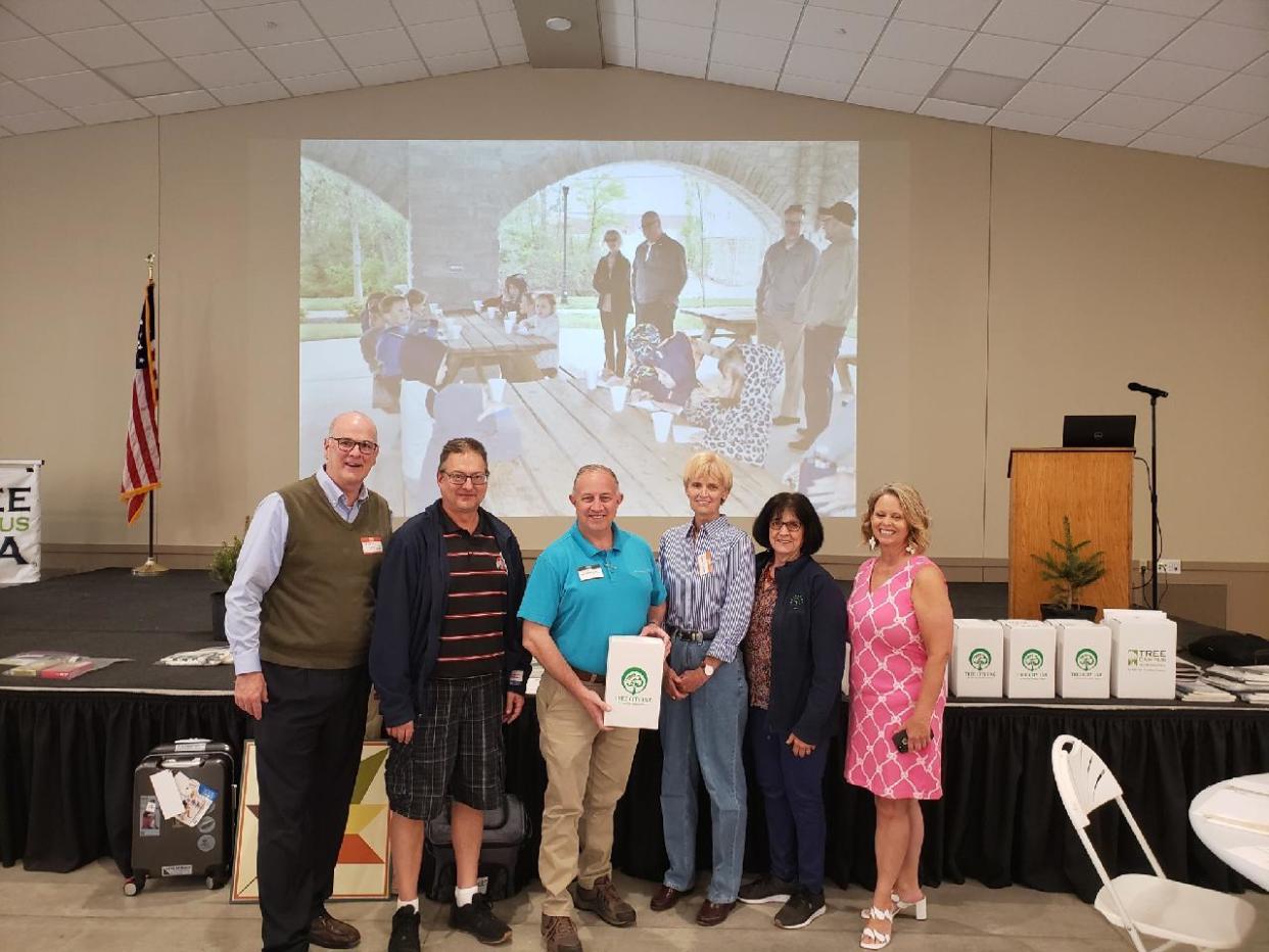 Mayor Jeff Reser, left, attended the Northwest Ohio Tree City USA awards ceremony in Findlay on May 11 with Bucyrus Tree Commission members, from left, Jeff Panovich, John Rostash, Valeries Spreng and Mary Lee Minor. Brad VanVoorhis was unable to attend. At the far right is Stephanie Miller, regional urban forester who presented the five-year award.