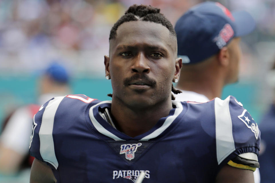 FILE - In this  Sept. 15, 2019, file photo, New England Patriots wide receiver Antonio Brown (17) on the sidelines, during the first half at an NFL football game against the Miami Dolphins in Miami Gardens, Fla. NFL free agent Antonio Brown turned himself in at a Florida jail on Thursday night, Jan, 24, 2020, following accusations that he and his trainer attacked another man. (AP Photo/Lynne Sladky, File)