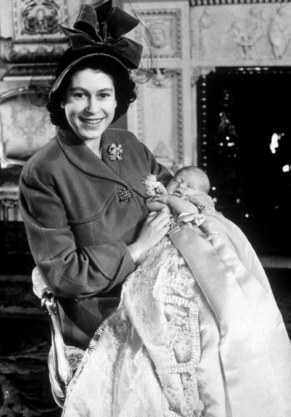 The Queen posed for a photograph with Prince Charles back in 1948 following his christening. [Photo: Getty]