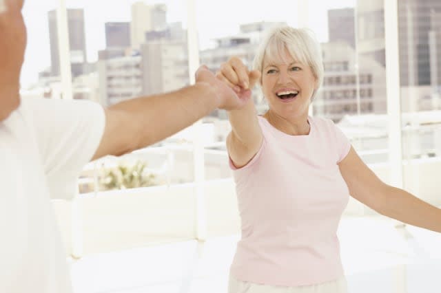 Senior exercising at gym