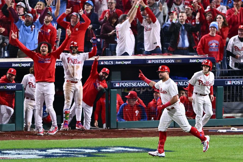 Philadelphia Phillies left fielder Kyle Schwarber (12) reacts after hitting a home run against the Arizona Diamondbacks in the sixth inning for Game 2 of the NLCS at Citizens Bank Park.