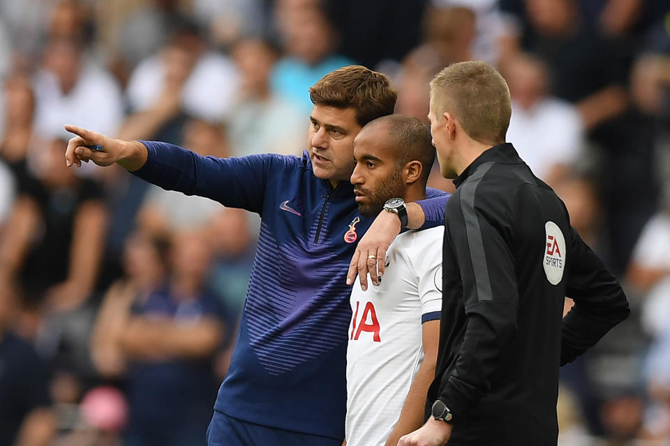 Tottenham Hotspur's Argentinian head coach Mauricio Pochettino (L) gestures during the English Premier League football match between Tottenham Hotspur and Crystal Palace at Tottenham Hotspur Stadium in London, on September 14, 2019. (Photo by DANIEL LEAL-OLIVAS / AFP) / RESTRICTED TO EDITORIAL USE. No use with unauthorized audio, video, data, fixture lists, club/league logos or 'live' services. Online in-match use limited to 120 images. An additional 40 images may be used in extra time. No video emulation. Social media in-match use limited to 120 images. An additional 40 images may be used in extra time. No use in betting publications, games or single club/league/player publications. /         (Photo credit should read DANIEL LEAL-OLIVAS/AFP/Getty Images)