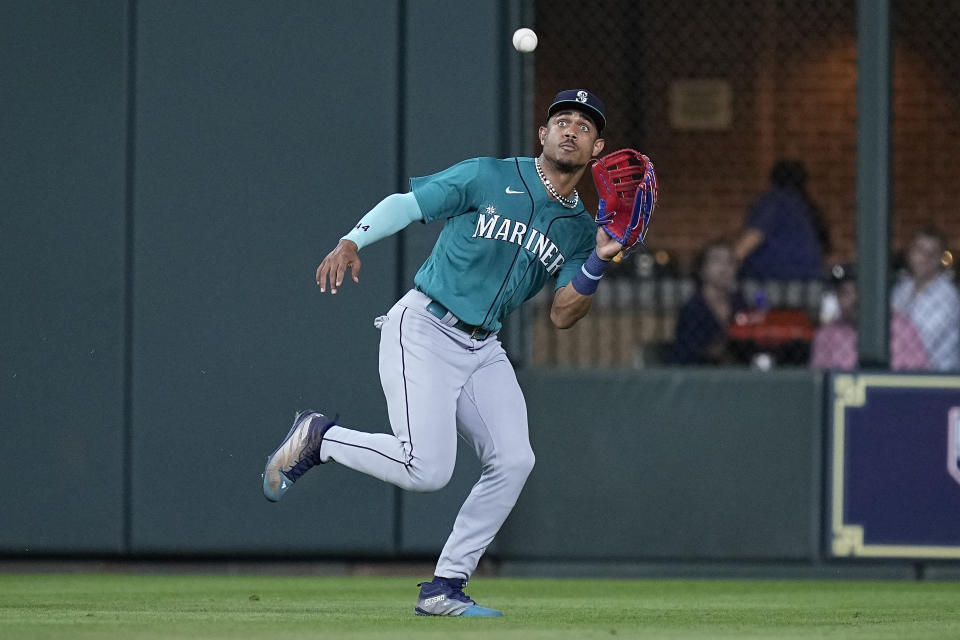 Seattle Mariners center fielder Julio Rodriguez catches a fly ball hit by Houston Astros' Corey Julks during the fifth inning of a baseball game Saturday, July 8, 2023, in Houston. (AP Photo/Kevin M. Cox)