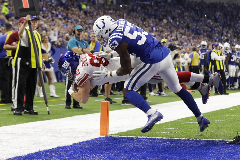 New York Giants tight end Scott Simonson (82) dives in for a touchdown under Indianapolis Colts outside linebacker Darius Leonard (53) during the first half of an NFL football game in Indianapolis, Sunday, Dec. 23, 2018. (AP Photo/Darron Cummings)