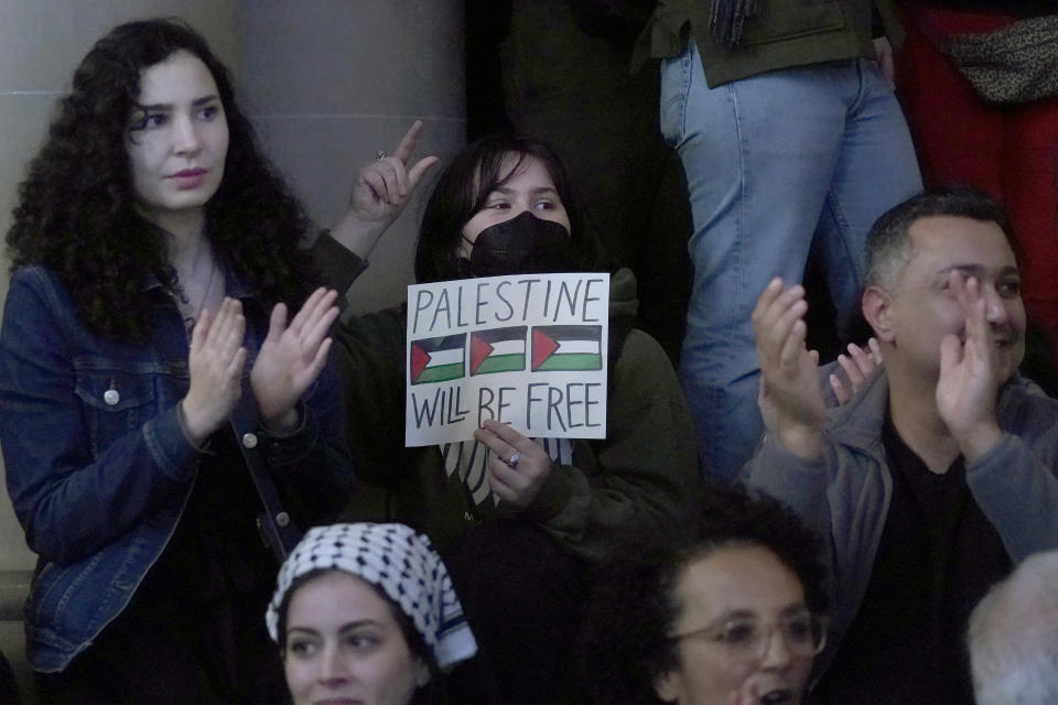 Pro-Palestinian supporters cheer after a San Francisco Board of Supervisors meeting in San Francisco, Tuesday, Jan. 9, 2024. San Francisco supervisors approved a slimmed-down resolution calling for a cease-fire in Gaza that condemns Hamas. Three of 11 supervisors voted no, with two saying they could not support a resolution that does not explicitly call out the atrocities of the Oct. 7 attack by Hamas on Israel. (AP Photo/Jeff Chiu)