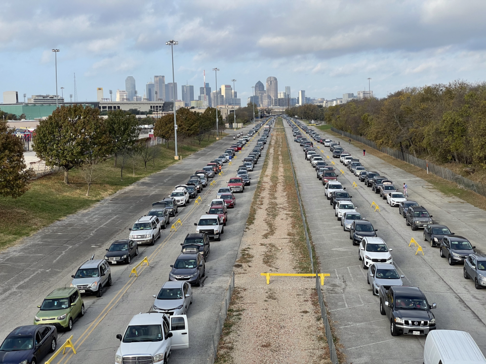 Long lines of cars are seen waiting to receive food during the event. / Credit: Spectra/Fair Park First