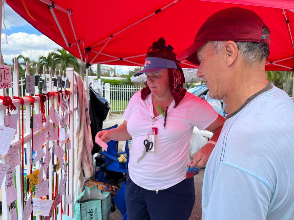 Libby Smith, 41, of Naples, uses notecards to match clean up volunteers to damaged units at Moorhead Manor in East Naples after Hurricane Ian flooded the manufactured home cooperative on Sept. 28, 2022.

(By Liz Freeman/Staff writer)