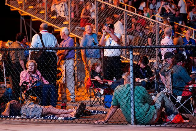 People are seen gathered ahead of Monday morning's scheduled launch. (Photo: via Associated Press)