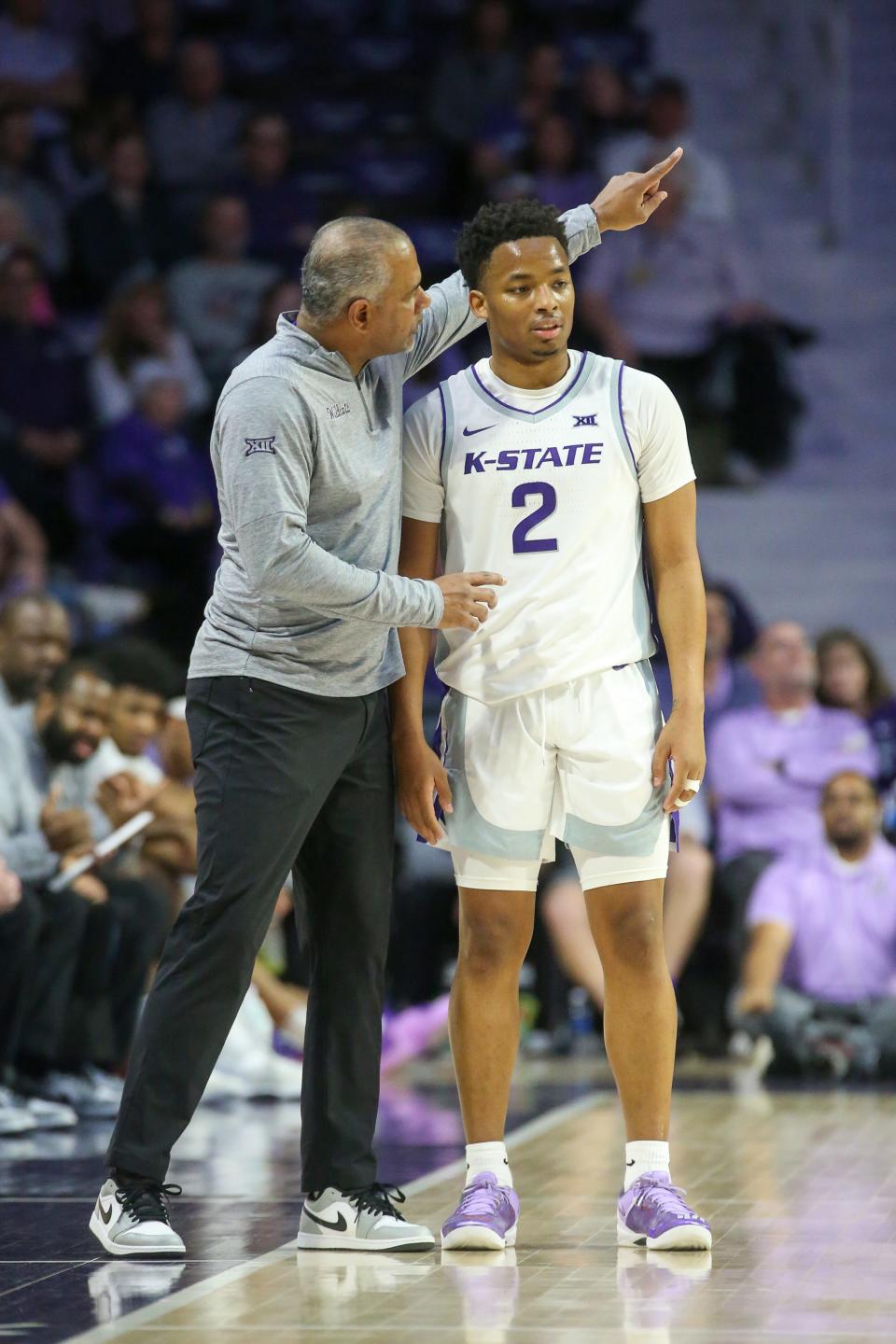Tylor Perry of Kansas State gets instructions from head coach Jerome Tang against West Virginia Feb. 26. Perry had 29 points in the Kansas State overtime victory.