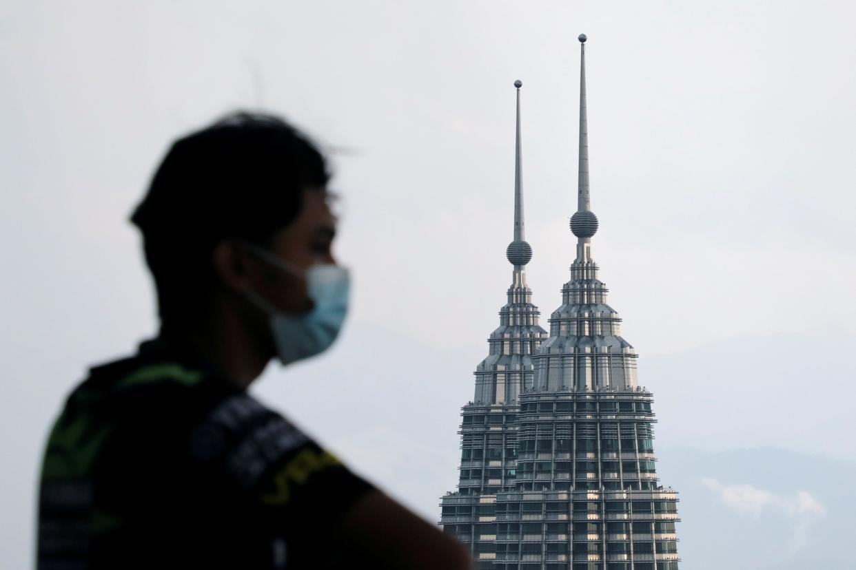 The aircraft was carrying two monks and military personnel for a ceremony to lay the foundations for a new monastery (pictured: Petronas Twin Towers in Kuala Lumpur) (REUTERS)