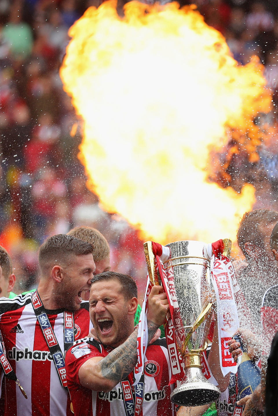 Billy Sheffield celebrating with trophy