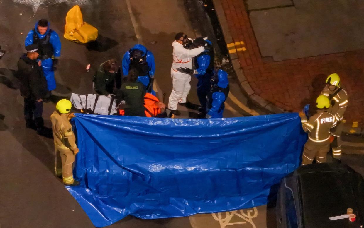 Emergency services, including officers in specialized blue chemical suits, were dispatched to the scene on London Road