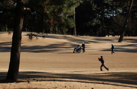 People play golf at Kasumigaseki Country Club in Kawagoe, Saitama Prefecture, Japan, January 25, 2017. REUTERS/Oh Hyun