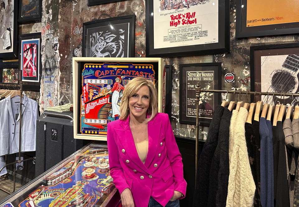 CNN broadcast journalist Alisyn Camerota poses at the former CBGBs nightclub, now a high-end men's clothing outlet, on March 29, 2024 in New York, to promote her memoir "Combat Love: A Story of Leaving, Longing, and Searching for Home." (AP Photo/Dave Bauder)